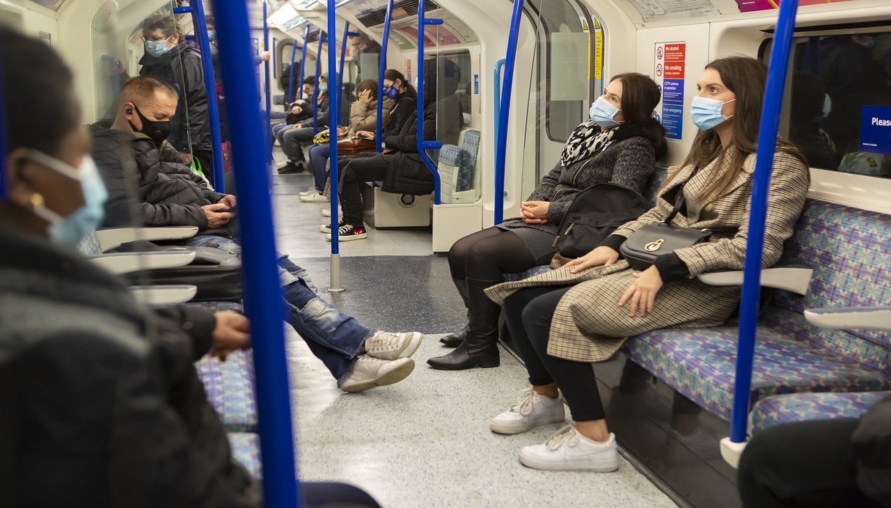 passengers on board the subway wearing masks