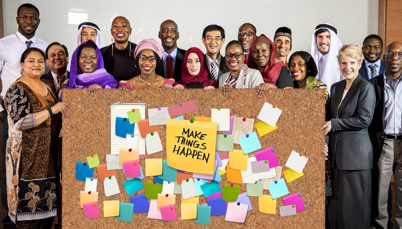 people from different backgrounds in a board meeting. 