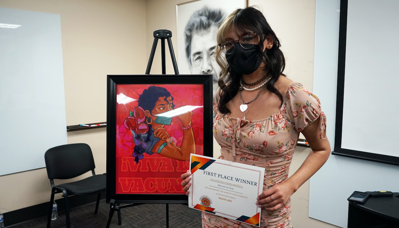 Montserrat Diaz with her first place prize. Photo courtesy of Servicios de la Raza.