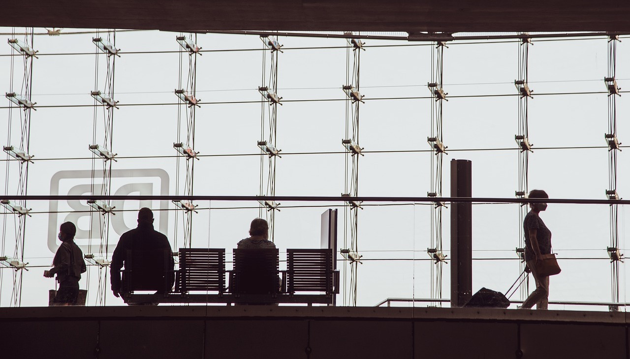 People walking through a bank hall.