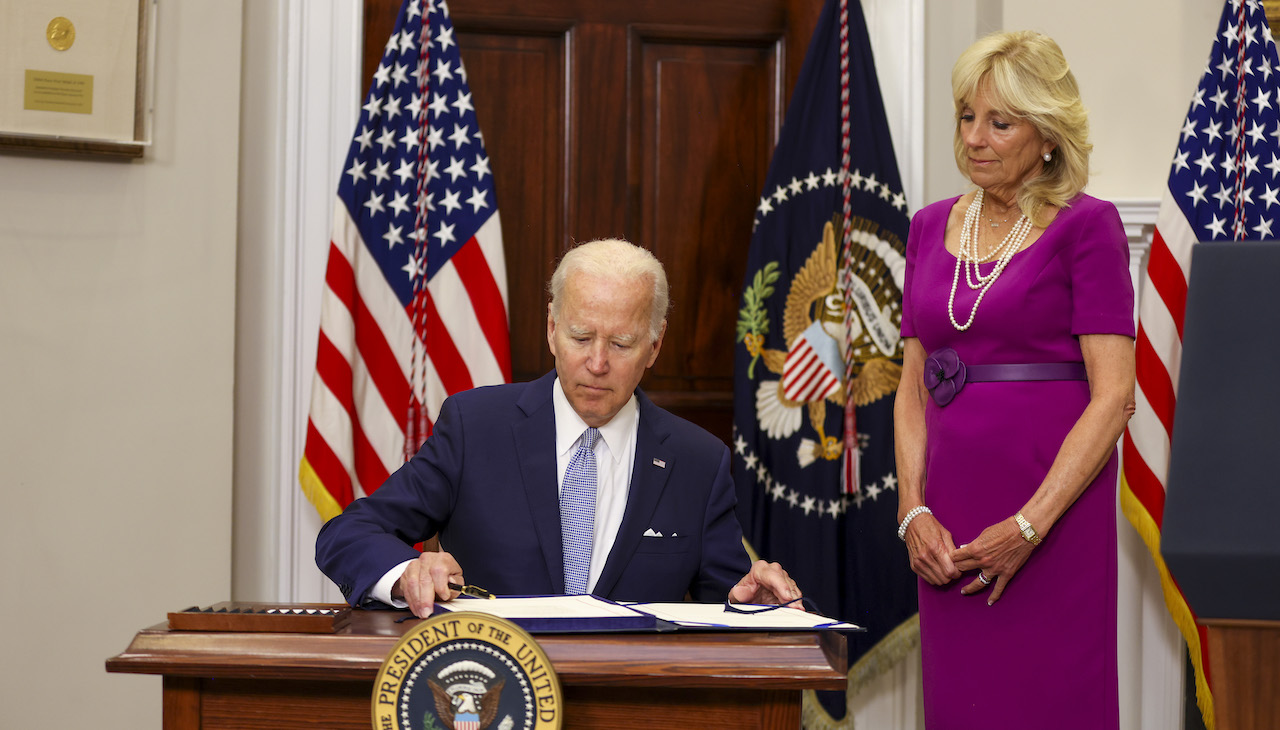 President Joe Biden signs the Bipartisan Safer Communities Act into law. Photo: Tasos Katopodis/Getty Images