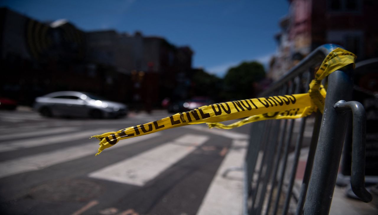 A scene from South Street on June 5, after a deadly mass shooting left three dead and 11 injured. Photo: Kriston Jae Bethel/AFP via Getty Images.