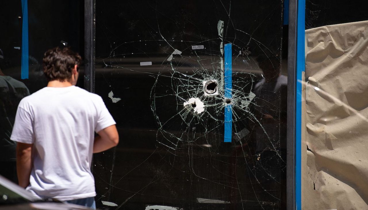 One of the many business fronts hit by gunfire during the mass shooting on South Street on the morning of June 5, 2022. Photo: Kriston Jae Bethel/AFP via Getty Images.