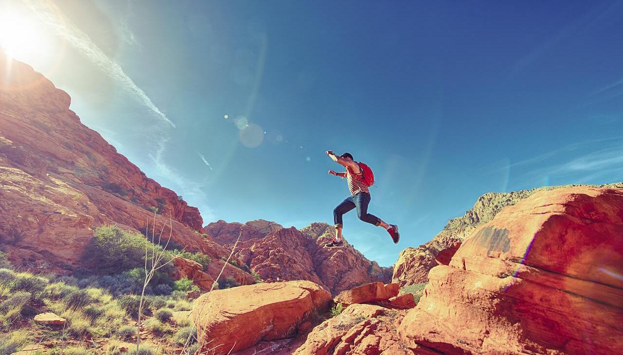 Man doing outdoor activities on a mountainous landscape.  