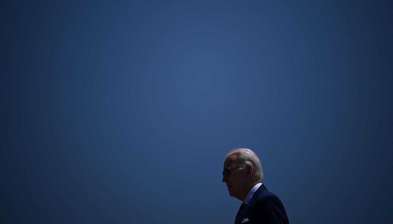 Photo of President Biden against the sky.