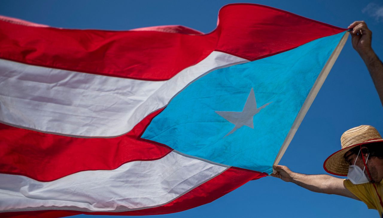 Puerto Ricans have been protesting to dissuade tourists from entering and destroying the island's beaches. Photo: Ricardo Arduengo/AFP via Getty Images.