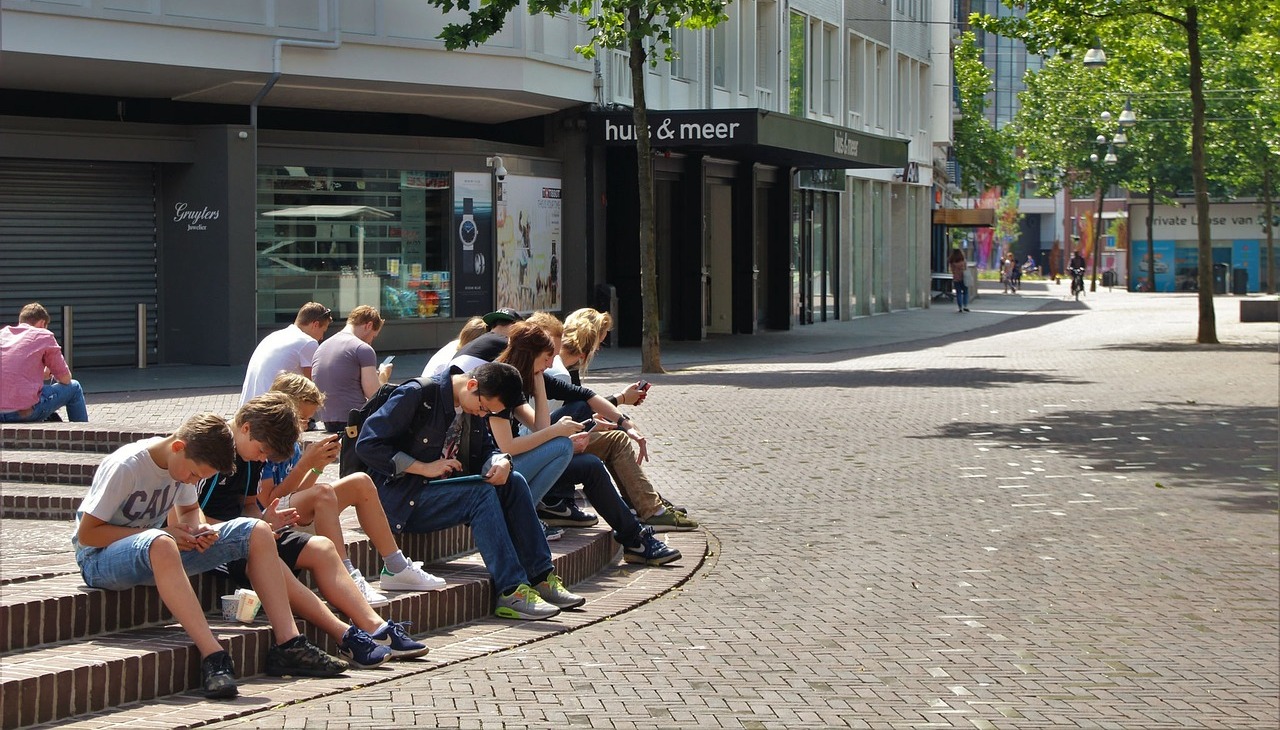 A group of students hanging out at college campus. 