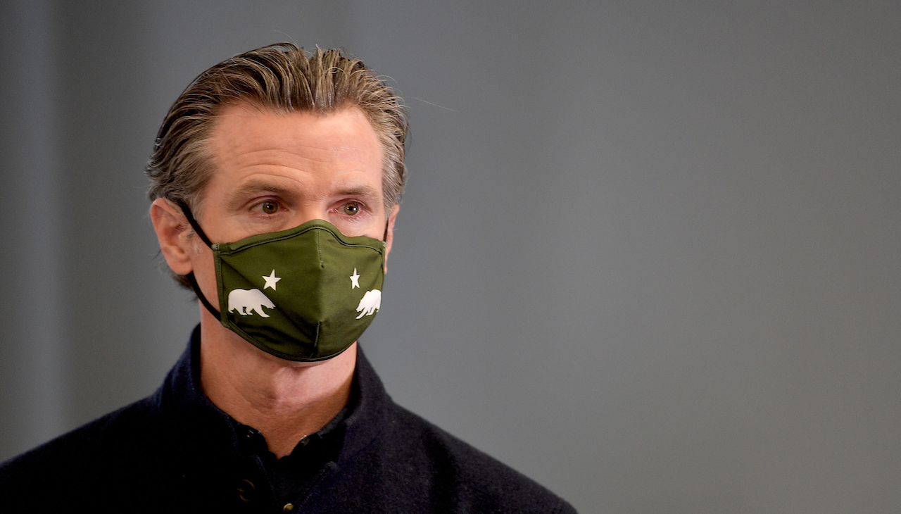 Pictured: California Governor Gavin Newsom with mask on. 