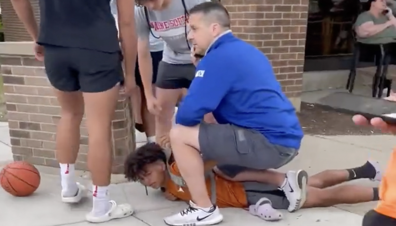 Off-duty Chicago Police Sergeant Michael Vitellaro kneels on the back a 14-year-old. Photo: Romanucci & Blandin