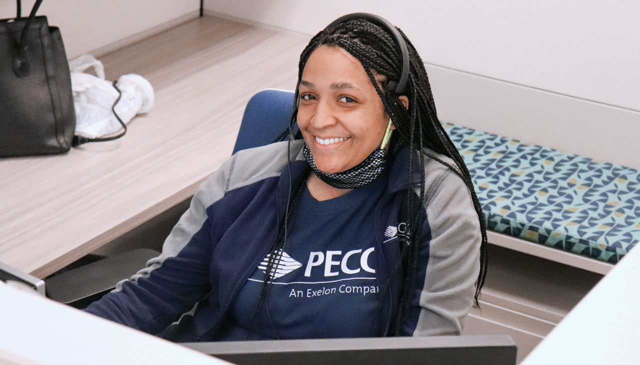 A PECO Customer Service Representative discusses financial assistance options with a customer in need of help.  PECO 