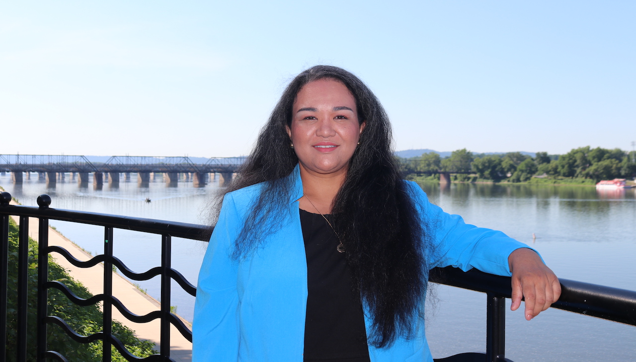 Pictured: Democratic US Rep candidate Sharmaine Daniels against a river