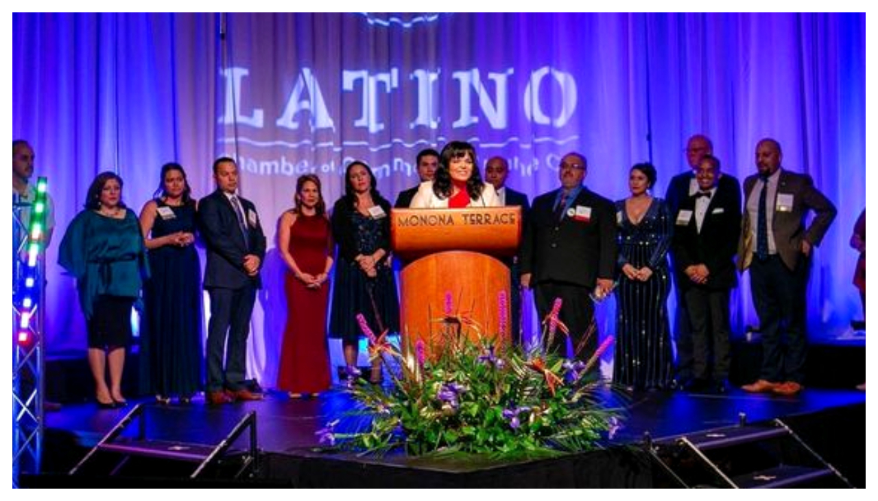 The Wisconsin Latino Chamber of Commerce at the podium as their CEO speaks.