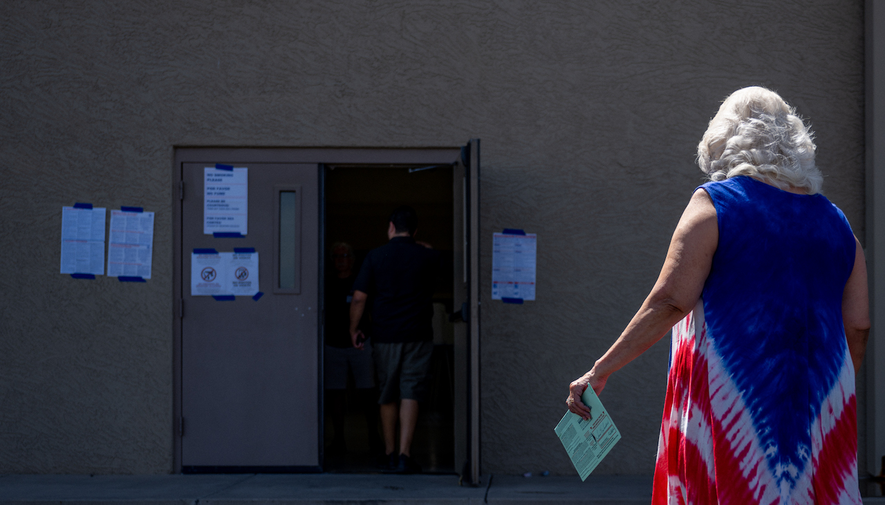 Pictured: Voter in polling place. Photo: Brandon Bell/Getty Images.