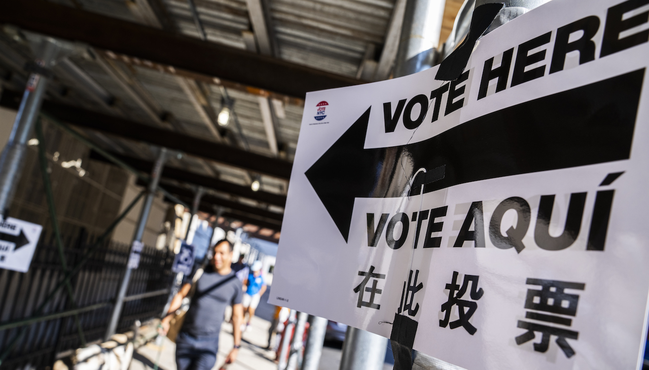 Pictured: Sign at a polling place that reads "Vote Here" and "Vote Aquí"