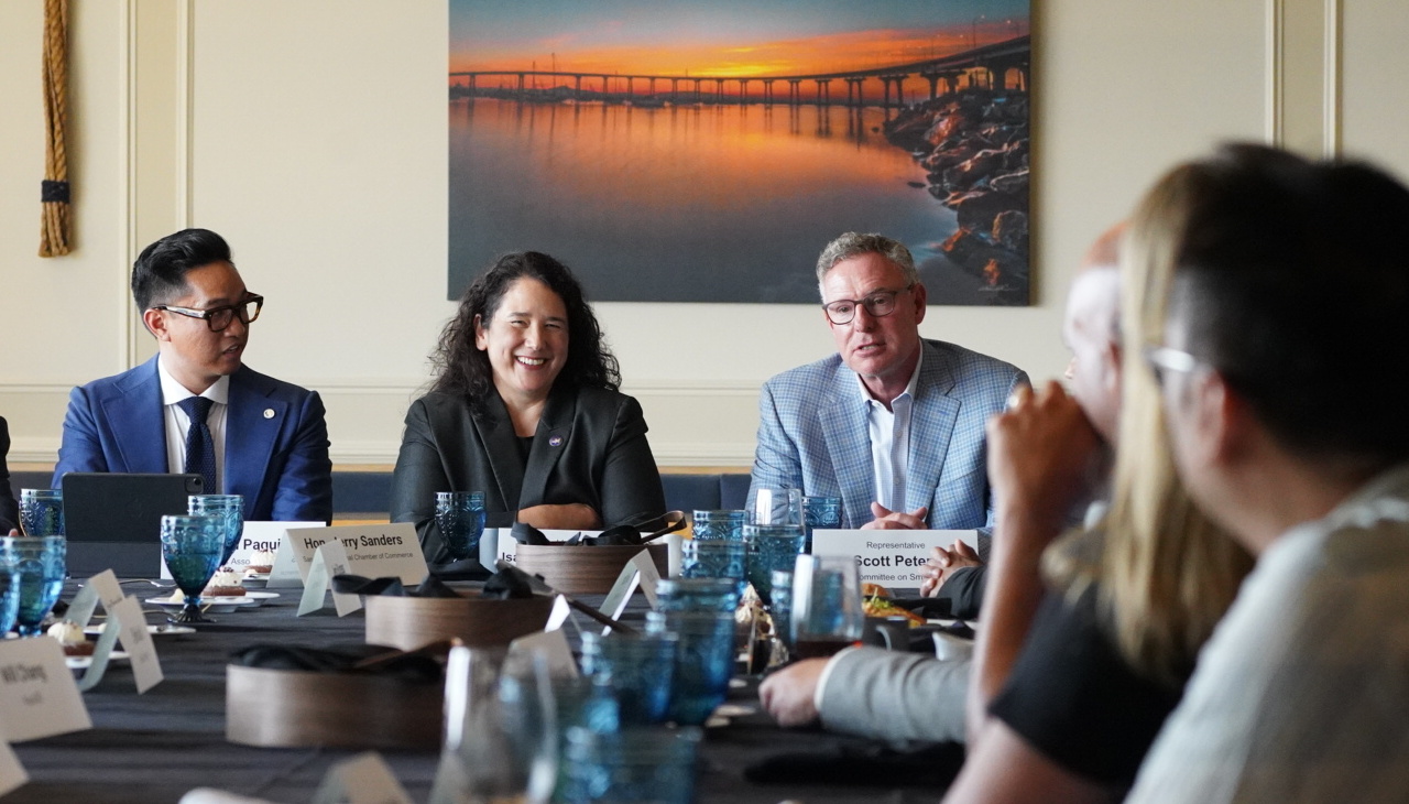 Isabel Casillas Guzmán meeting with local business owners.