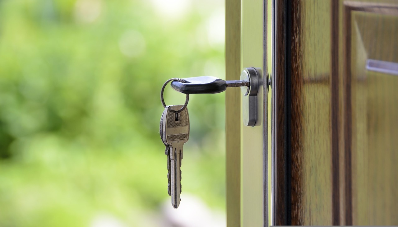 Keys on a house door's lock.