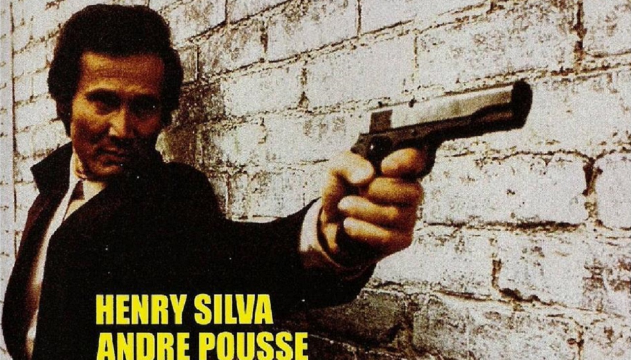 Henry Silva appears in this fragment of the poster for 'L'insolent', a 1973 film directed by Jean-Claude Roy.