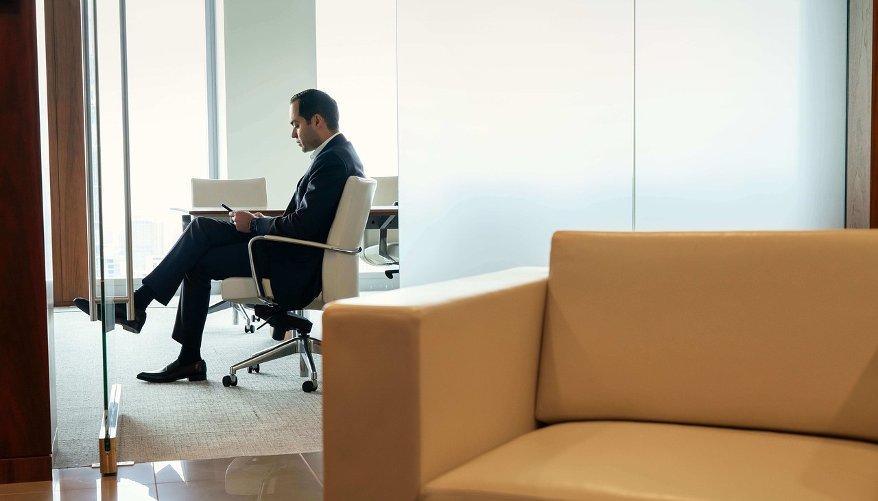 Man sitting alone on a board of directors. 