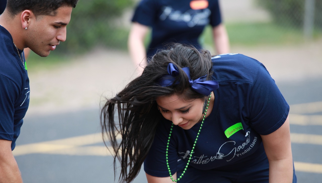 Latinos playing street games.