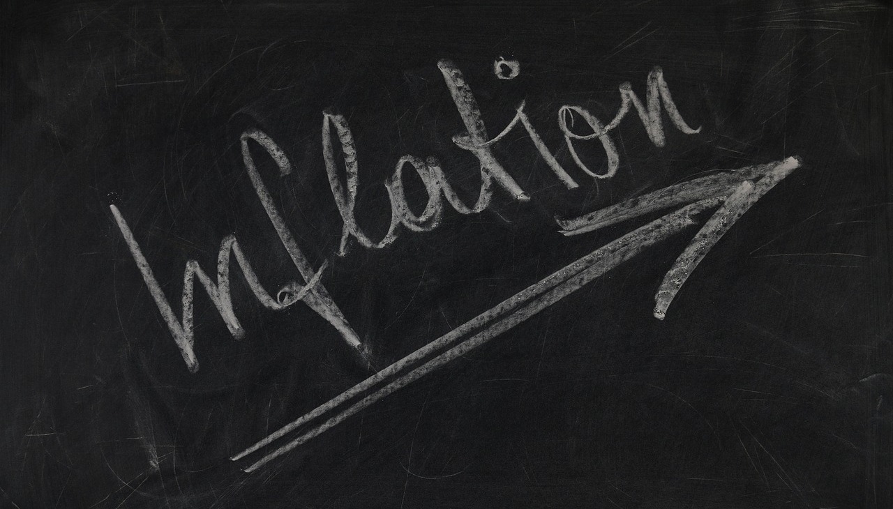 Chalk board with the word Inflation written. 