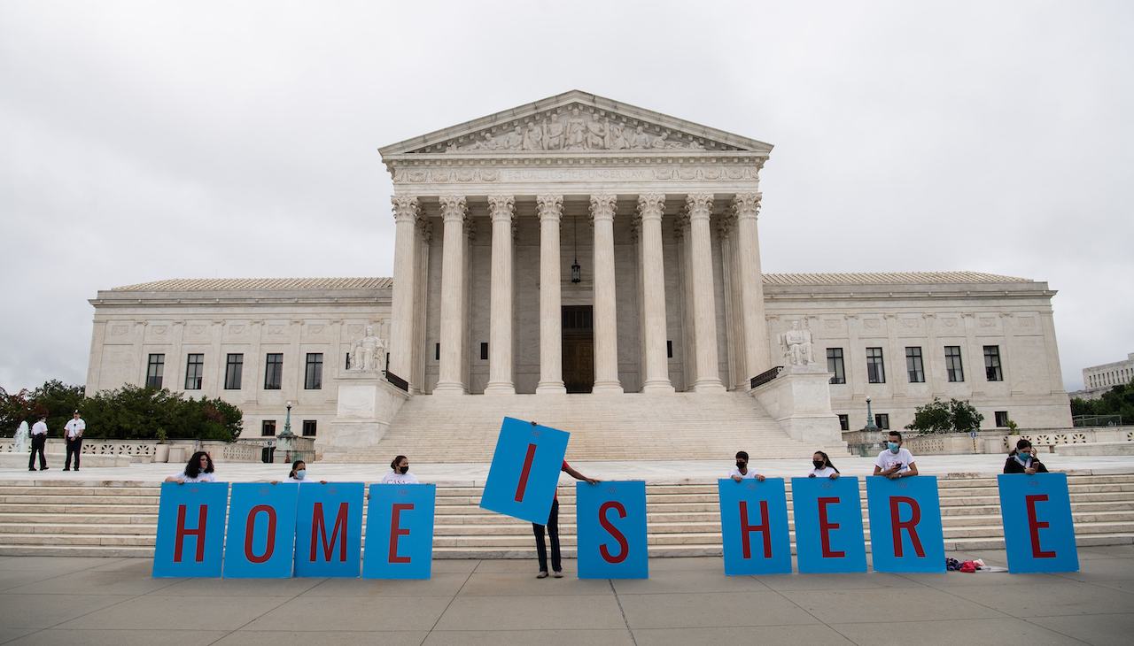 Pictured: U.S. Supreme Court with activists holding sign that reads: Home is Home. Photo: Nicholas Kamm/AFP via Getty Images.