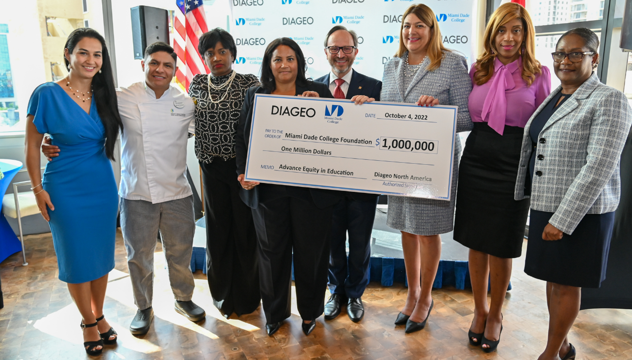 Diageo presents symbolic check to MDC representatives. 