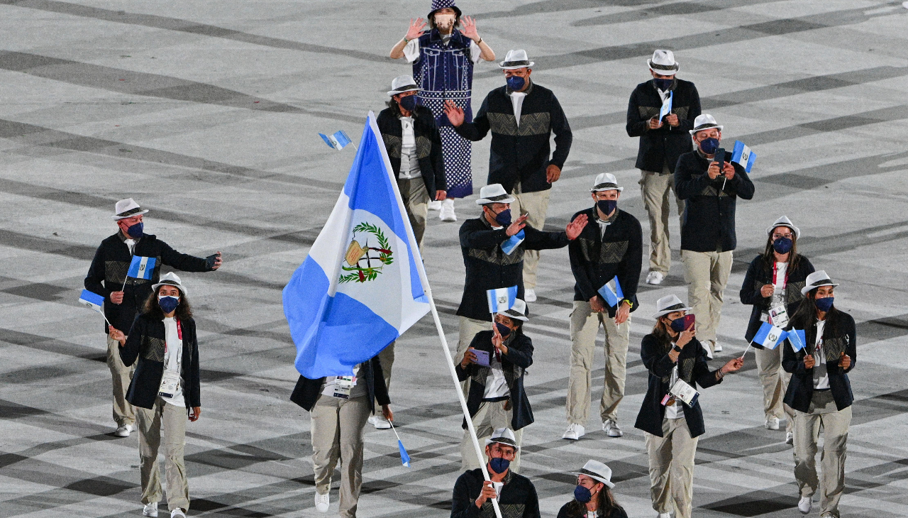 Guatemala's flag bearers and athletes during the opening ceremony of the Tokyo 2020 Olympic Games. Photo: Martin Bureau/AFP via Getty Images.