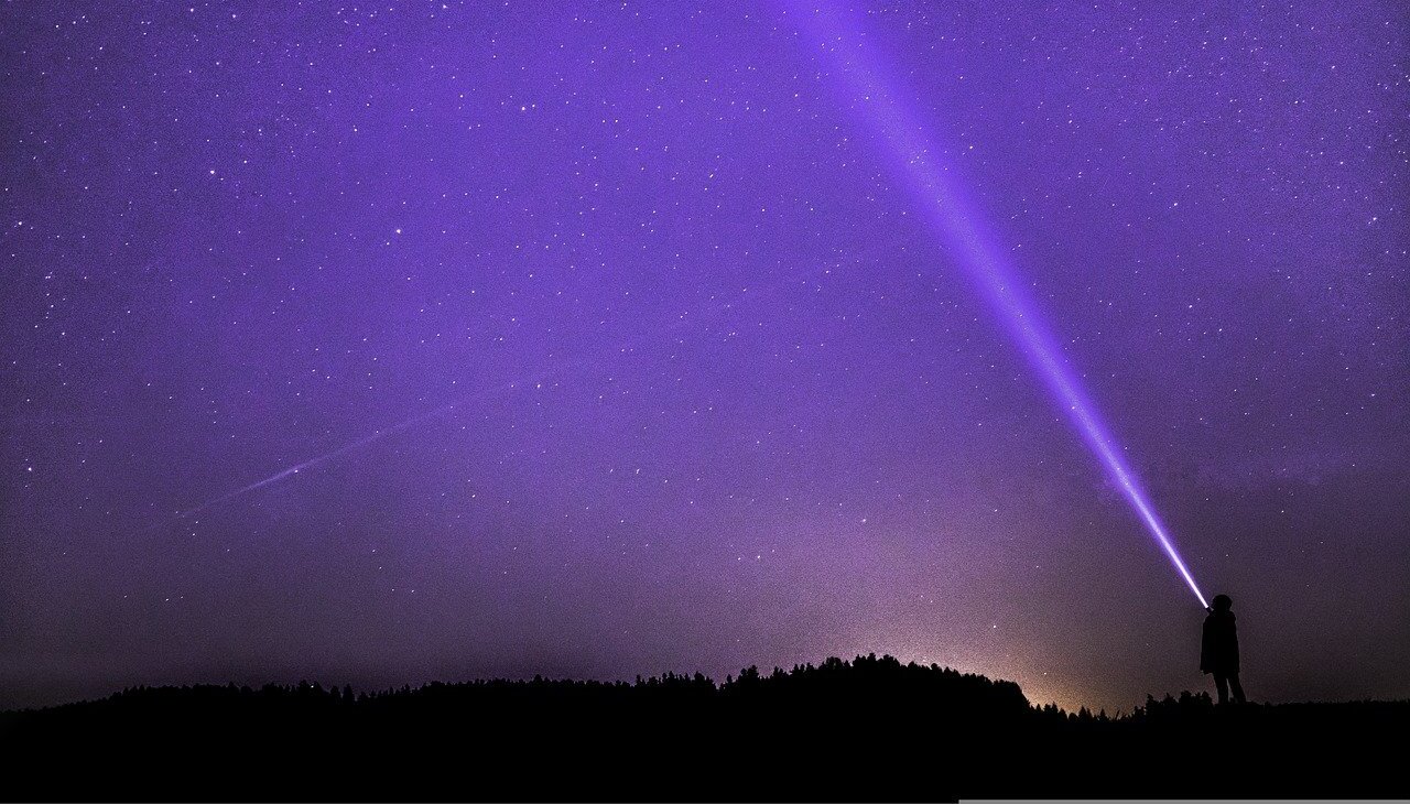 A photographer on a starry night. 