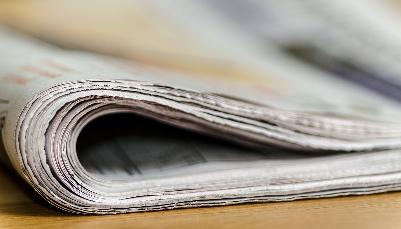 Newspapers on a table. 