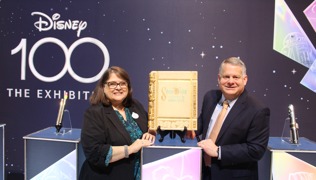 Rebecca Cline, director of the Walt Disney Archives and Larry Dubinski, President and CEO of the Franklin Institute stand with the prop book from Snow White and the Seven Dwarfs. Photo credit: Emily Leopard-Davis/AL DÍA News.