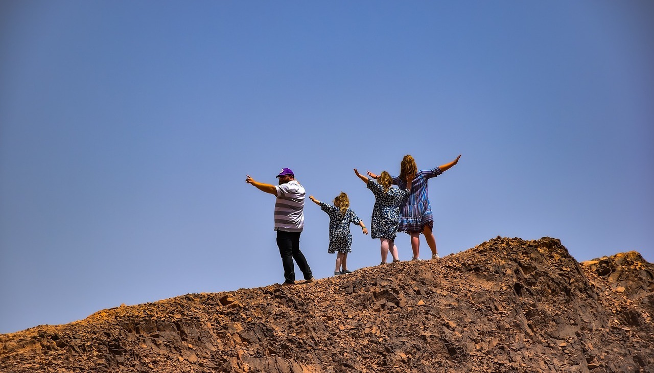 Family at the top of a mountain. 