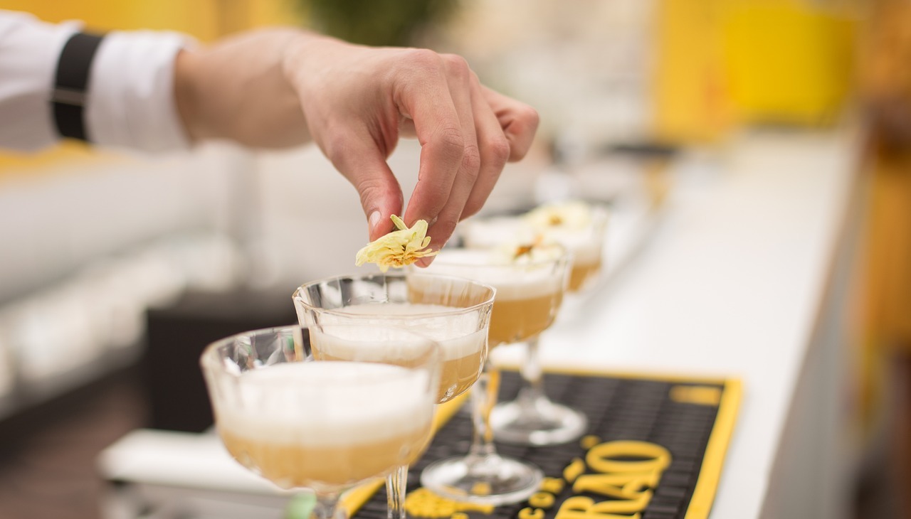 Bartender fixing various cocktails. 