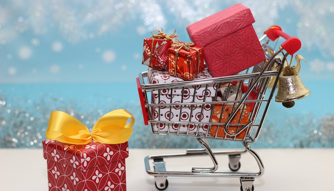 Shopping cart full of Christmas gifts.