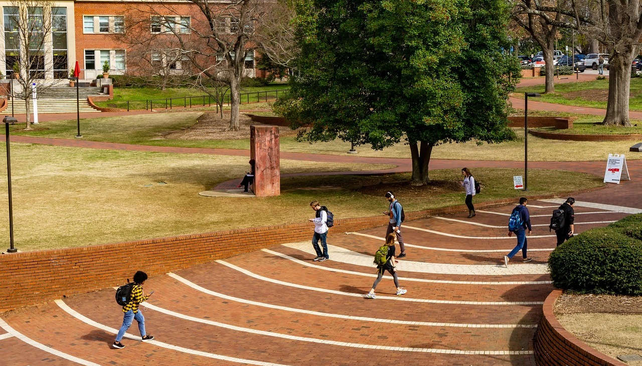 College campus with a few students. 