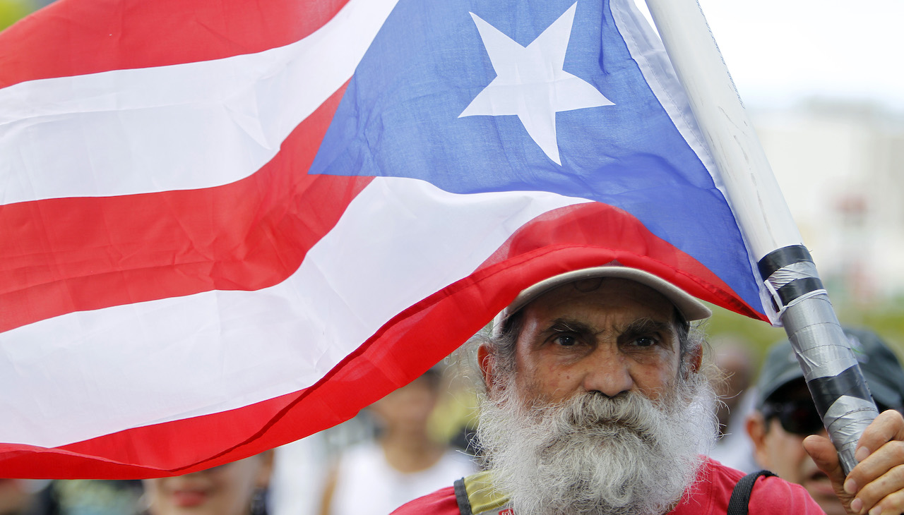 Man flies Puerto Rico flag. 