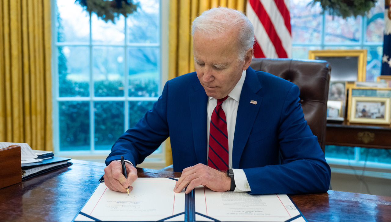 President Biden signing documents.