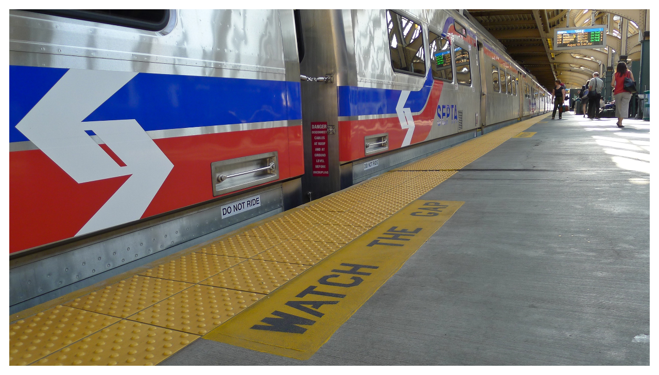 A low angle view of a SEPTA train stopping at a station.