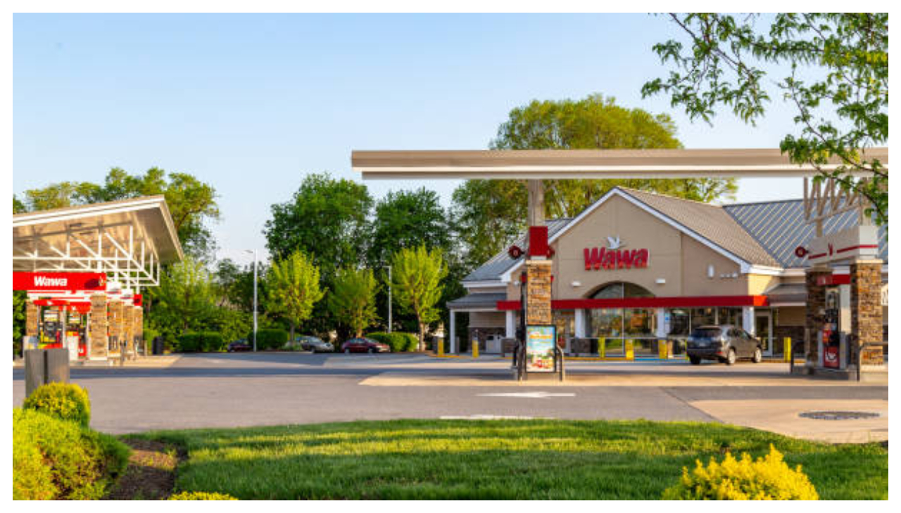 A Wawa with a gas station structure in front of it.