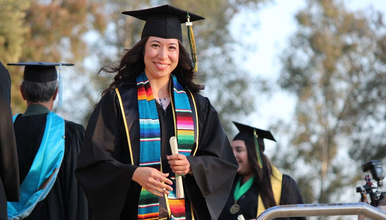 Diverse woman graduating.