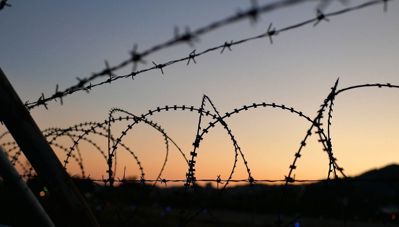 Migrant camp fence. 