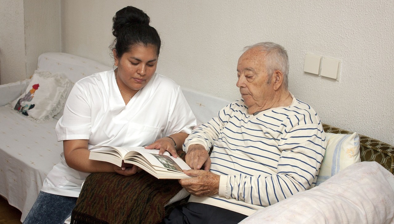 Nurse taking care of Alzheimer's patient. 