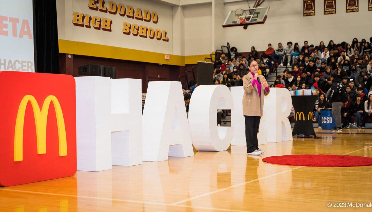 Katya Echazarreta giving a speech to high school students. 