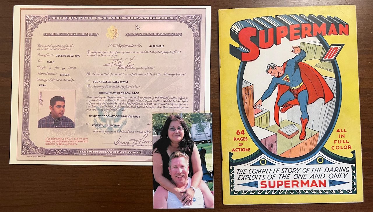 Rep. García's certificate of citizenship, a picture of his late parents, and a Superman #1 Comic. 