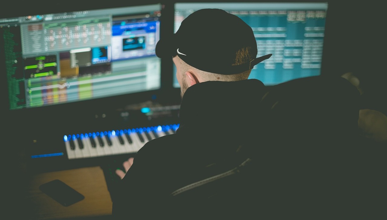 Music producer working in a recording studio. 