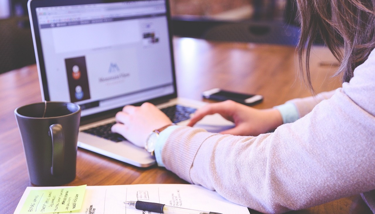 Woman works on a startup from her laptop. 