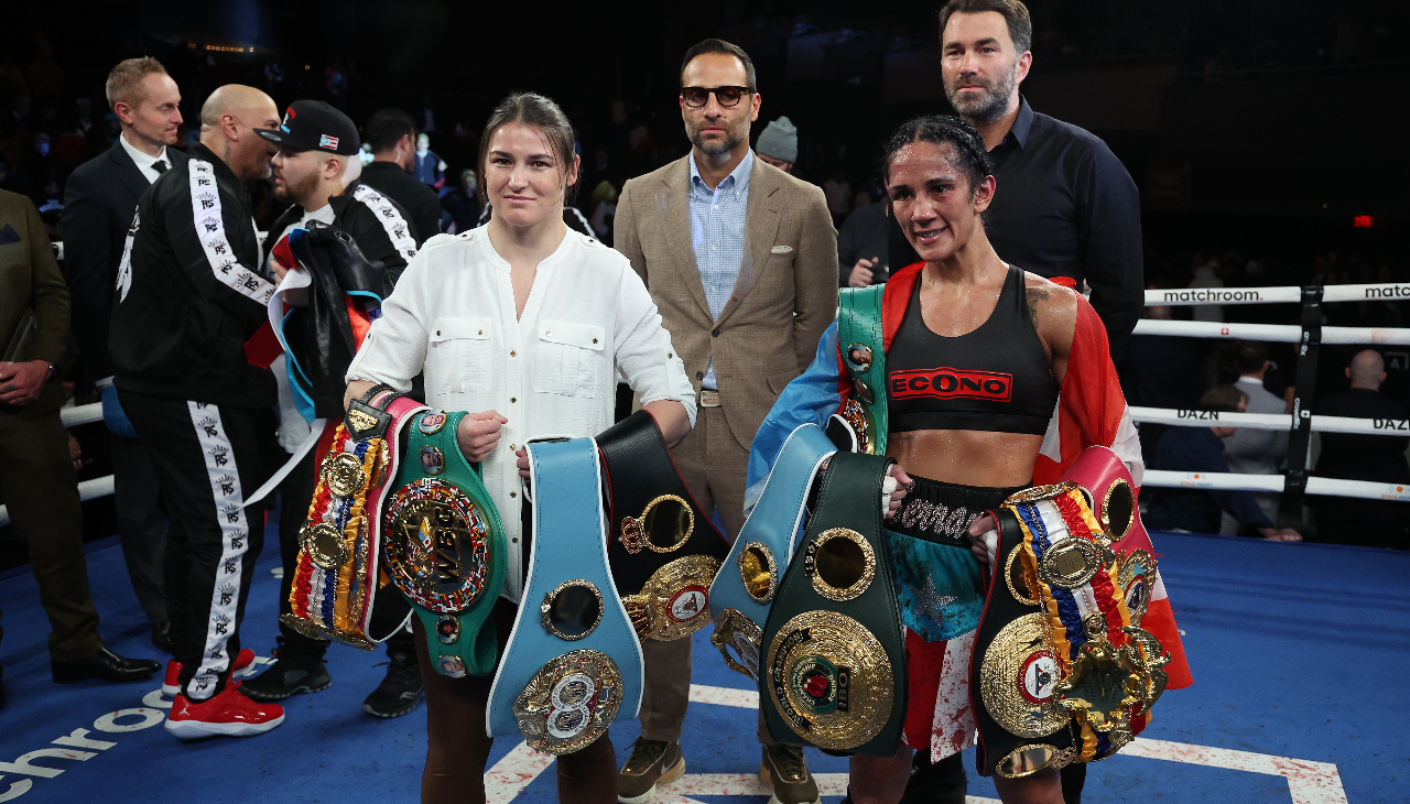 Amanda Serrano (right) poses with Katie Taylor (left) in the ring after becoming the first Puerto Rican undisputed boxing champion. Photo: Al Bello/Getty Images.