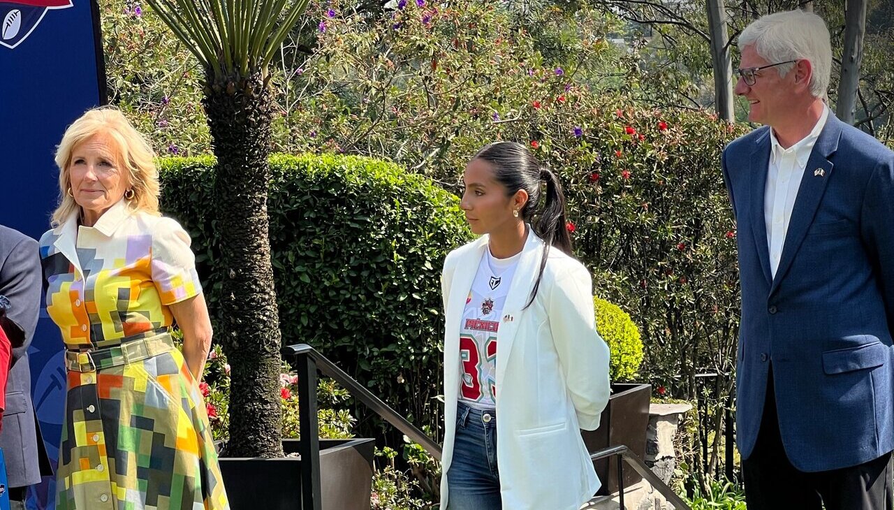 First Lady of the U.S. next to Mexican Quarter Back Diana Flores.