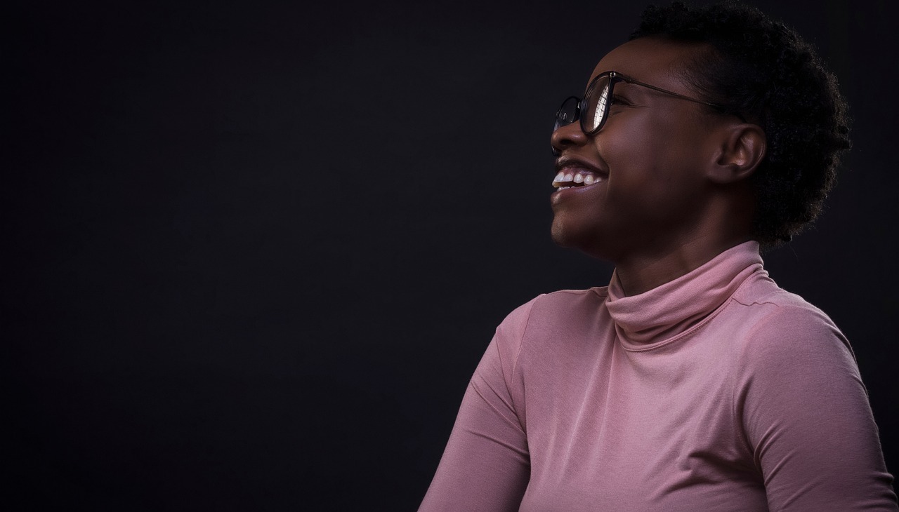 Black woman entrepreneur smiling.