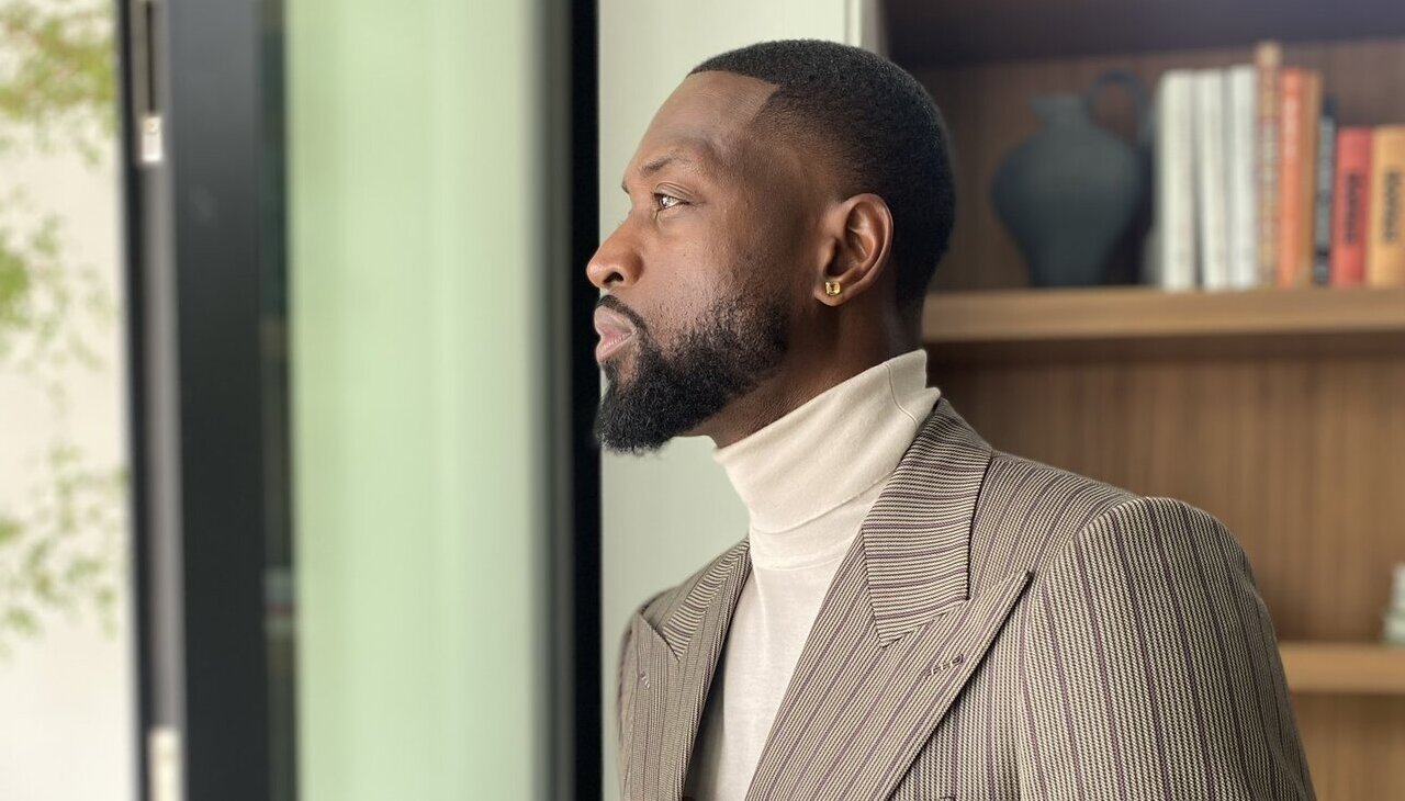 Dwyane Wade posing with Gucci suit.