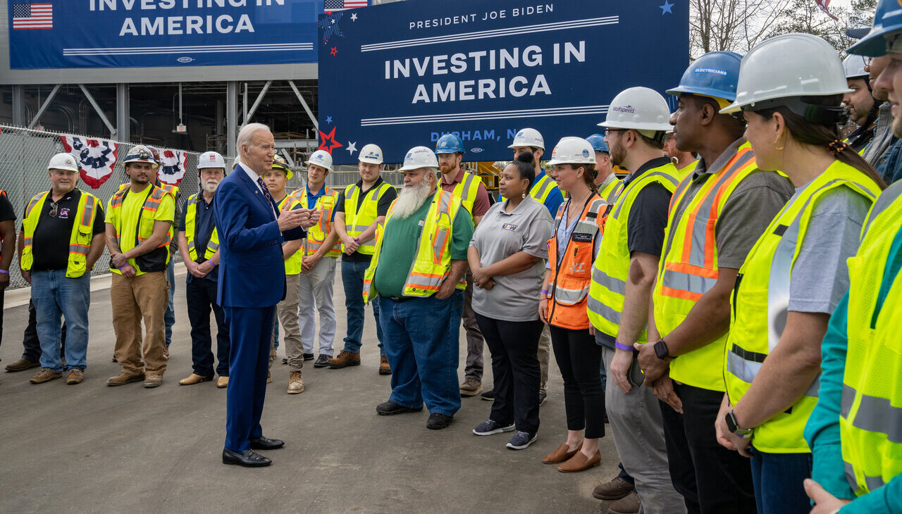 President Biden talks to manufacturing employees. 